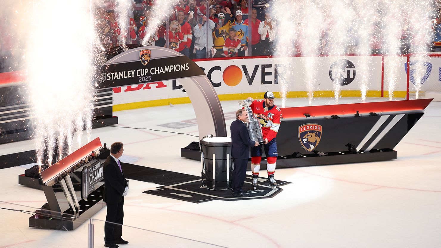 Aleksander Barkov accepts the Stanley Cup from NHL Commissioner Gary Bettman after defeating the Edmonton Oilers.