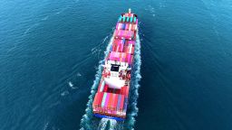 A cargo ship fully loaded with foreign trade containers leaves the port of Qingdao in Qingdao City, Shandong Province, China.