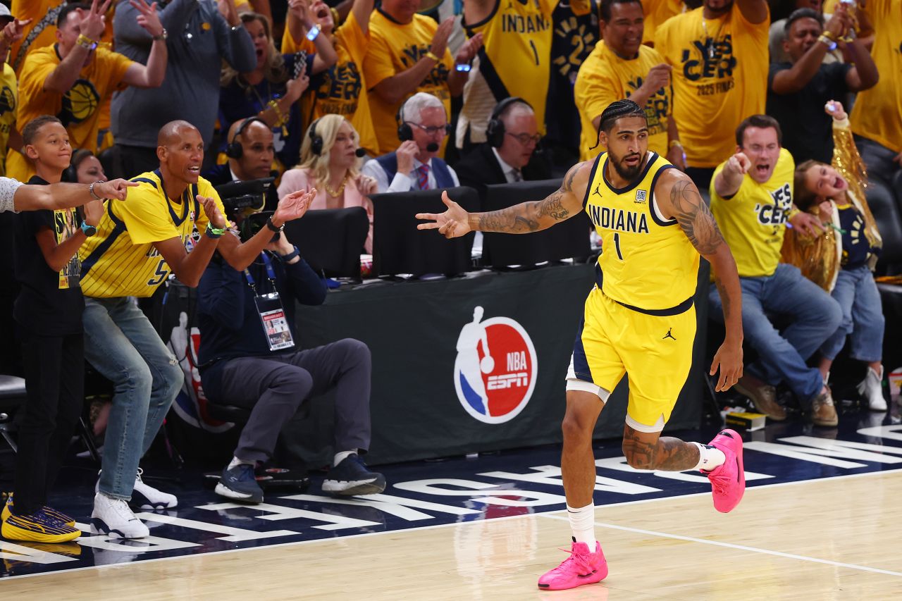 Indiana Pacers legend Reggie Miller cheers on Obi Toppin after Toppin hit a 3-pointer during the Pacers' Game 6 blowout.