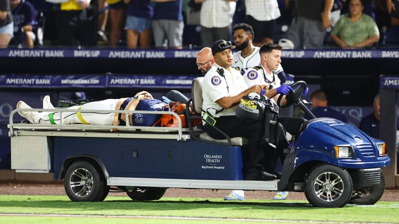 Rays pitcher carted off field after foul ball strikes him in dugout