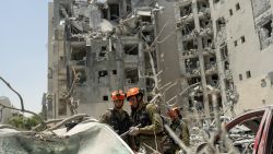 Emergency responders work at a building where four people were killed by an Iranian missile strike on June 24, 2025 in Beersheba, Israel. According to Israeli authorities, Iran launched a barrage of missiles in the early hours this morning, before the start of a U.S.-brokered ceasefire between the two countries. The Iranian foreign minister said that, if Israel stopped its attacks as of this morning, Iran would also end its strikes.