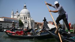Tourists enjoy a gondola ride on the Grand Canal in Venice lagoon on June 25, 2025. Celebrities in superyachts sail into Venice this week for the three-day wedding party of Amazon tycoon Jeff Bezos and Lauren Sanchez, despite irate locals who say the UNESCO city is no billionaire's playground. The tech magnate and journalist have reportedly invited about 200 guests to their multi-million dollar nuptials in the Italian city, which are expected to kick off on June 26 and end Saturday with a ceremony at a secret location.