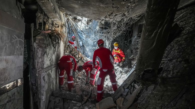 Rescuers sift through the rubble inside in the Evin prison complex in Tehran that was hit days ago by an Israeli strike, on June 25, 2025. The Israeli defence minister announced strikes on the prison and other domestic security agencies in Tehran on June 23. (Photo by Mostafa Roudaki / mizanonline / AFP) (Photo by MOSTAFA ROUDAKI/mizanonline/AFP via Getty Images)          