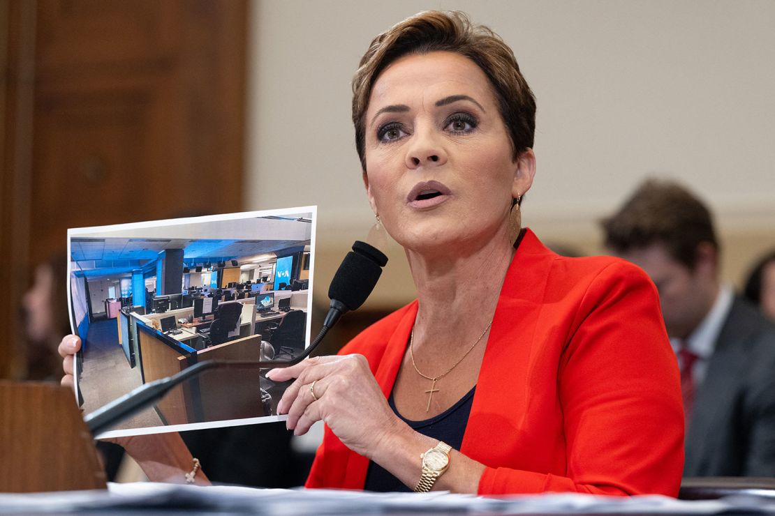 Kari Lake, Senior Advisor for US Agency for Global Media, holds up a photo of the Voice of America newsroom as she testifies during a House Foreign Affairs Committee hearing on the future of the US Agency for Global Media, on Capitol Hill in Washington, DC on Wednesday.