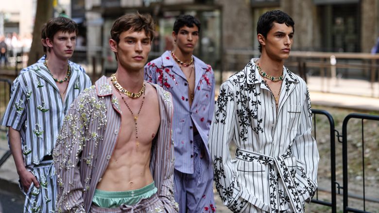 MILAN, ITALY - JUNE 21: Models are walking the runway outside the show venue at Metropol, during Dolce & Gabbana, during the Milan Fashion Week - Menswear Spring/Summer 2026 on June 21, 2025 in Milan, Italy. (Photo by Edward Berthelot/Getty Images)