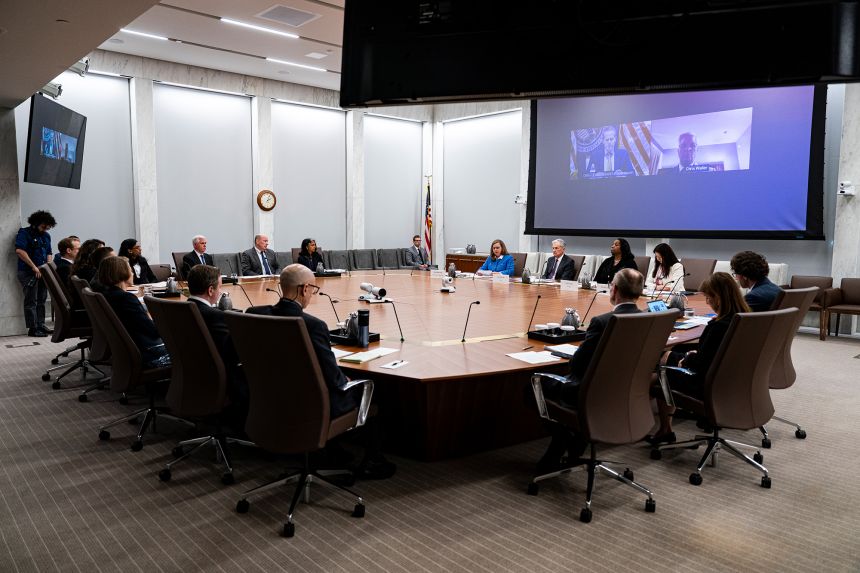 Members of the Federal Reserve meet in Washington, DC, on June 25, with Fed Chair Jerome Powell at center right.