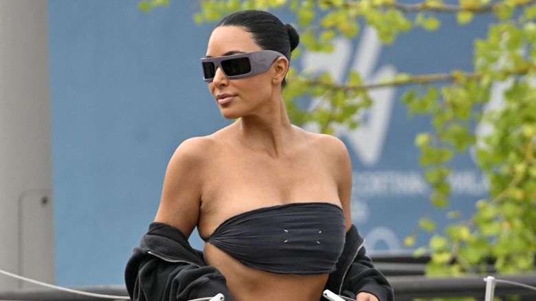 US reality TV personalities Kim Kardashian walks to board a taxi boat at Venice Marco Polo airport ahead of Jeff Bezos' wedding on June 26, 2025. Celebrities in superyachts sail into Venice this week for the three-day wedding party of Amazon tycoon Jeff Bezos and Lauren Sanchez, despite irate locals who say the UNESCO city is no billionaire's playground. The tech magnate and journalist have reportedly invited about 200 guests to their multi-million dollar nuptials in the Italian city, which are expected to kick off on June 26 and end Saturday with a ceremony at a secret location. (Photo by ANDREA PATTARO / AFP) (Photo by ANDREA PATTARO/AFP via Getty Images)          
