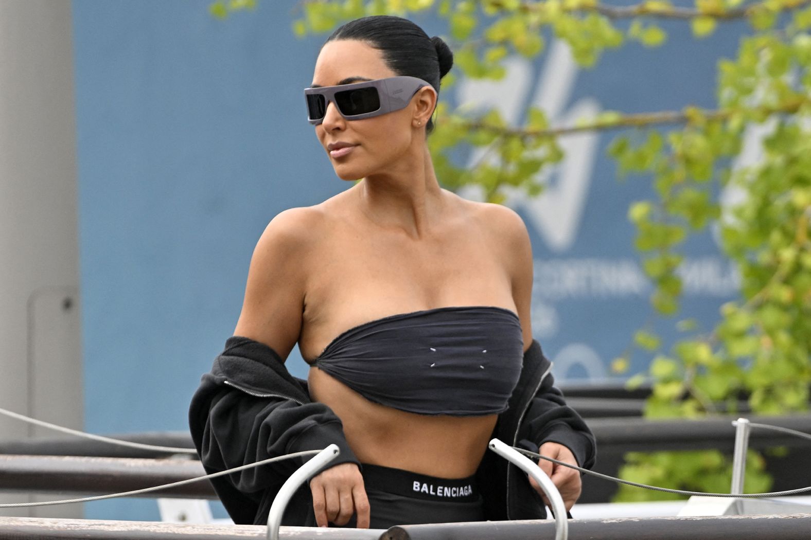 Kim Kardashian boards a taxi boat wearing Balenciaga at the Venice Marco Polo Airport on Thursday.