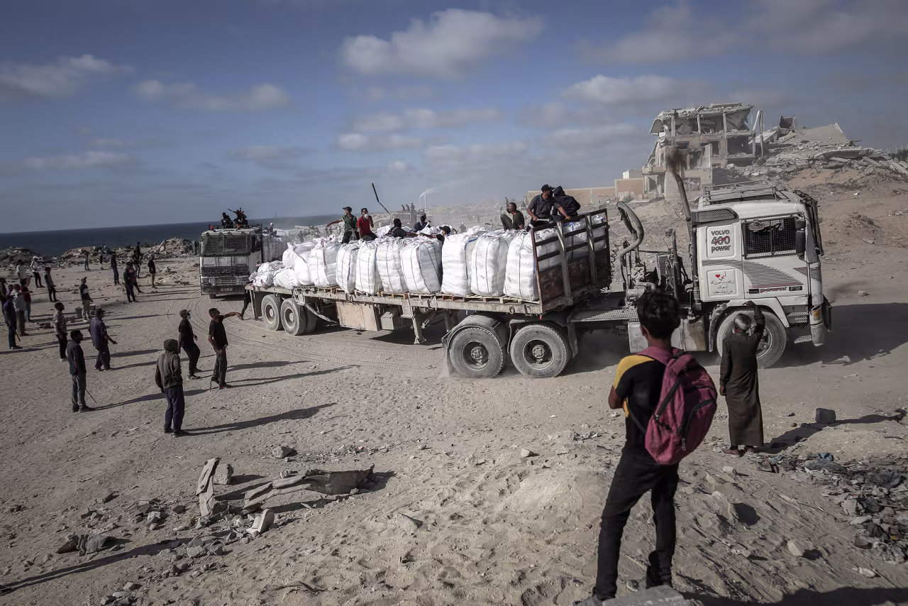 Trucks carrying humanitarian aid arrive in Beit Lahia, Gaza, on Wednesday.