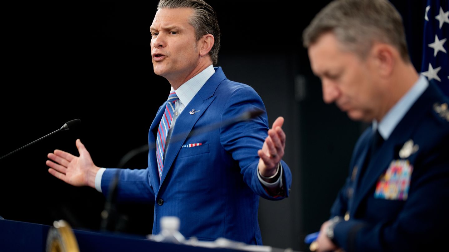 U.S. Defense Secretary Pete Hegseth (L) accompanied by Chairman of the Joint Chiefs of Staff Air Force Gen. Dan Caine (R), speaks during a news conference at the Pentagon on June 26, 2025 in Arlington, Virginia. Top officials from the Department of Defense gave an update after three Iranian nuclear facilities were struck by the U.S. military last weekend and Iran countered by launching missiles at Al Udeid Air Base in Qatar.