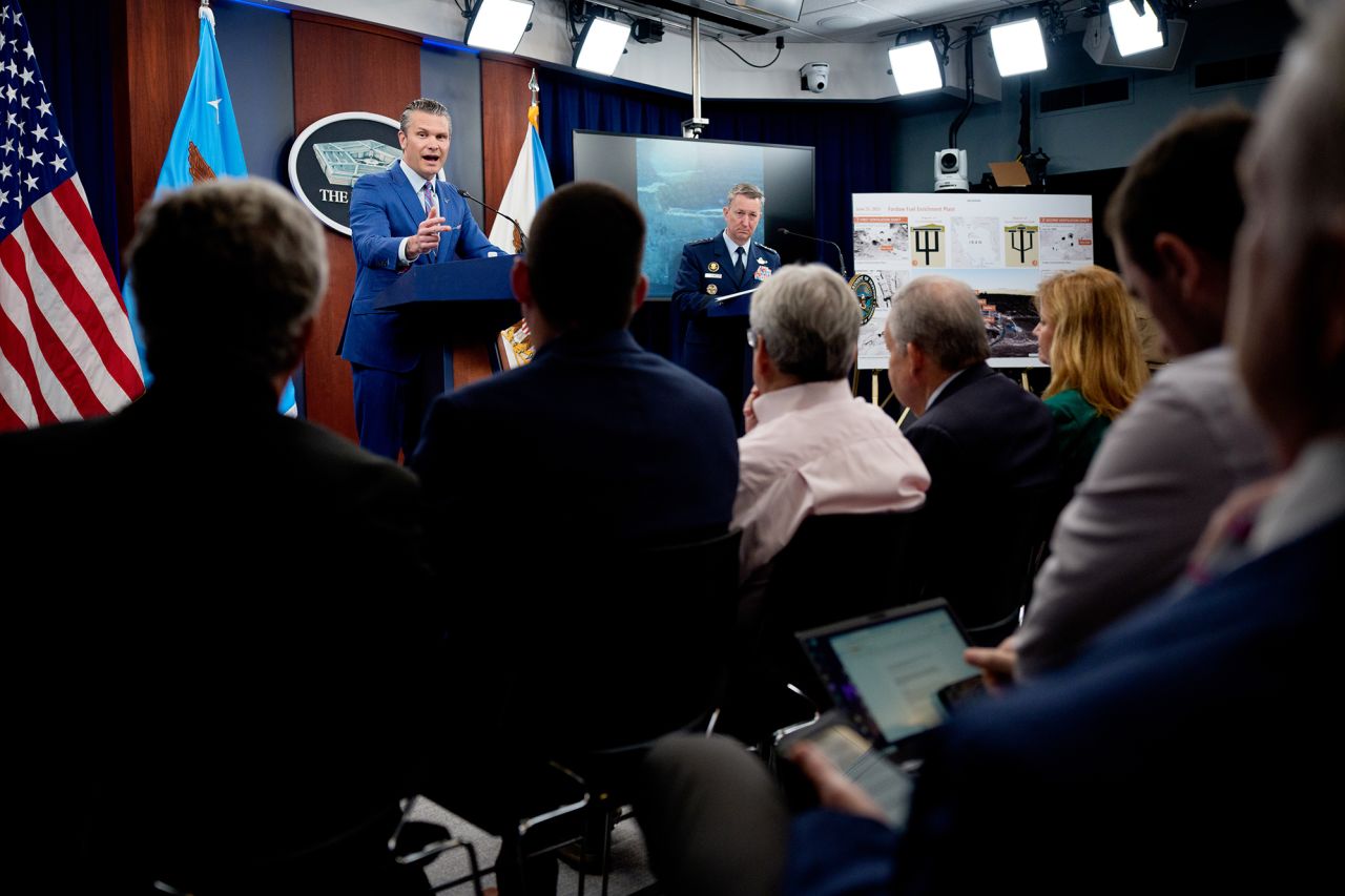 Defense Secretary Pete Hegseth, left, accompanied by Chairman of the Joint Chiefs of Staff Air Force Gen. Dan Caine speaks during a news conference at the Pentagon on Thursday.