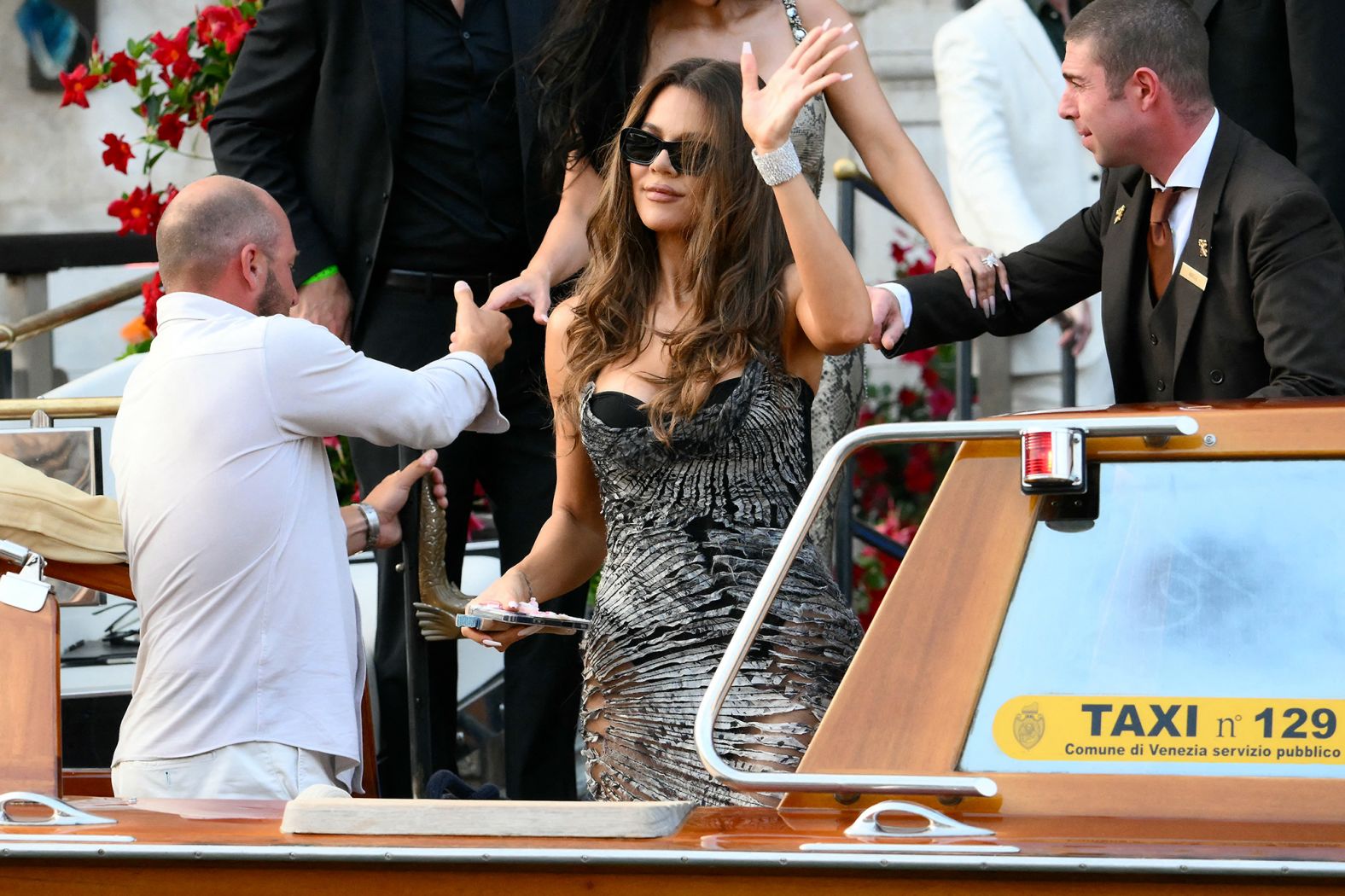 Khloe Kardashian boards a taxi boat on Thursday.