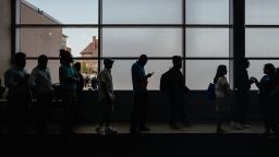 Businesses highly uncertain about the direction of the economy in the wake of massive (and changing) tariffs proposed by President Donald Trump have held off on hiring, causing once-solid job gains to slow. Other policies, including federal workforce cuts, have turned public servants into jobseekers such as those seen here waiting to enter a job fair hosted by the Cook County government to support federal workers in Chicago on June 26, 2025.