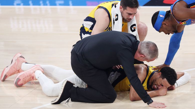 OKLAHOMA CITY, OKLAHOMA - JUNE 22: Tyrese Haliburton #0 of the Indiana Pacers sustains an injury during the first quarter as Shai Gilgeous-Alexander #2 of the Oklahoma City Thunder checks on him in Game Seven of the 2025 NBA Finals at Paycom Center on June 22, 2025 in Oklahoma City, Oklahoma. NOTE TO USER: User expressly acknowledges and agrees that, by downloading and or using this photograph, User is consenting to the terms and conditions of the Getty Images License Agreement. (Photo by Justin Ford/Getty Images)