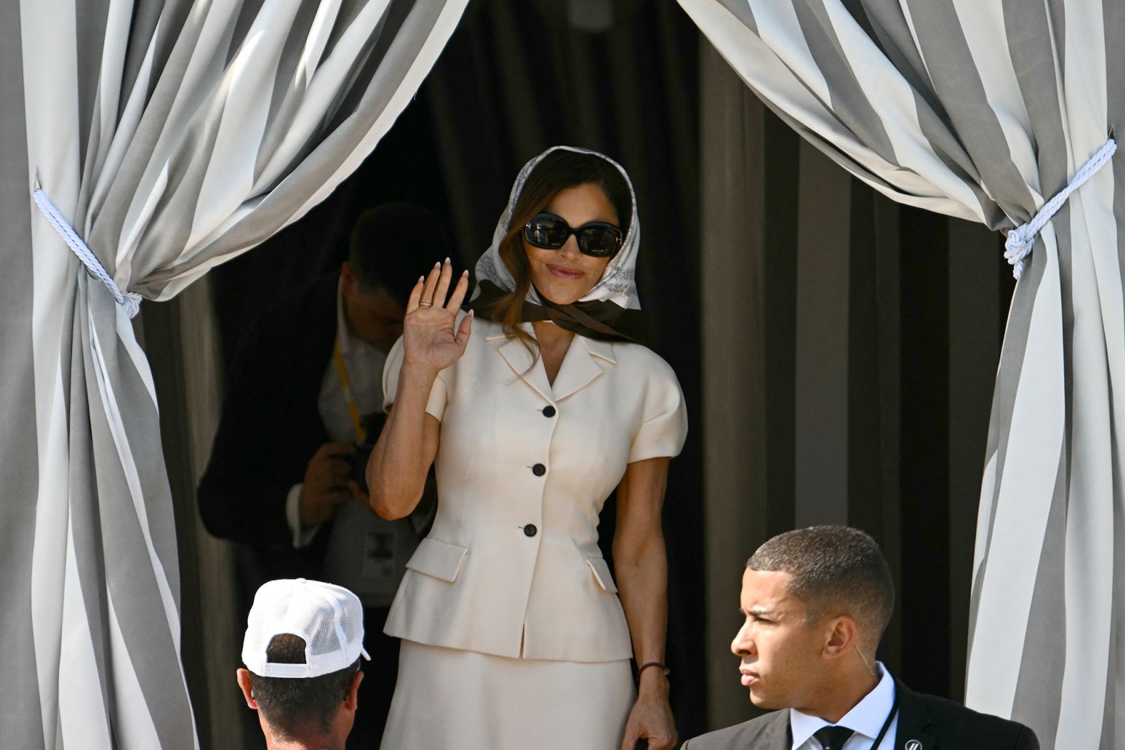 Sanchez leaves the Aman hotel, ahead of her wedding to Bezos on Friday. She was wearing a white tailored Dior skirt suit and Tom Ford sunglasses as she headed to the island of San Giorgio Maggiore.