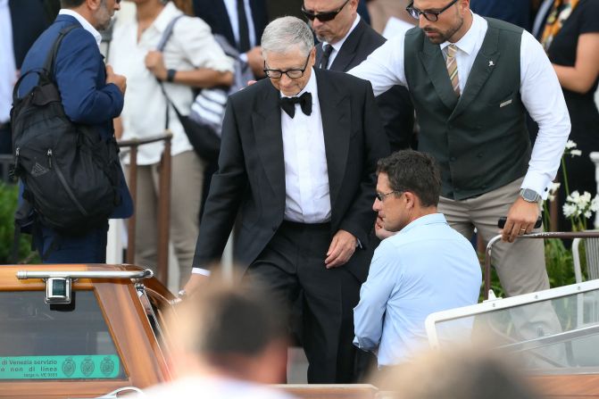 Bill Gates gets on a taxi boat Friday.