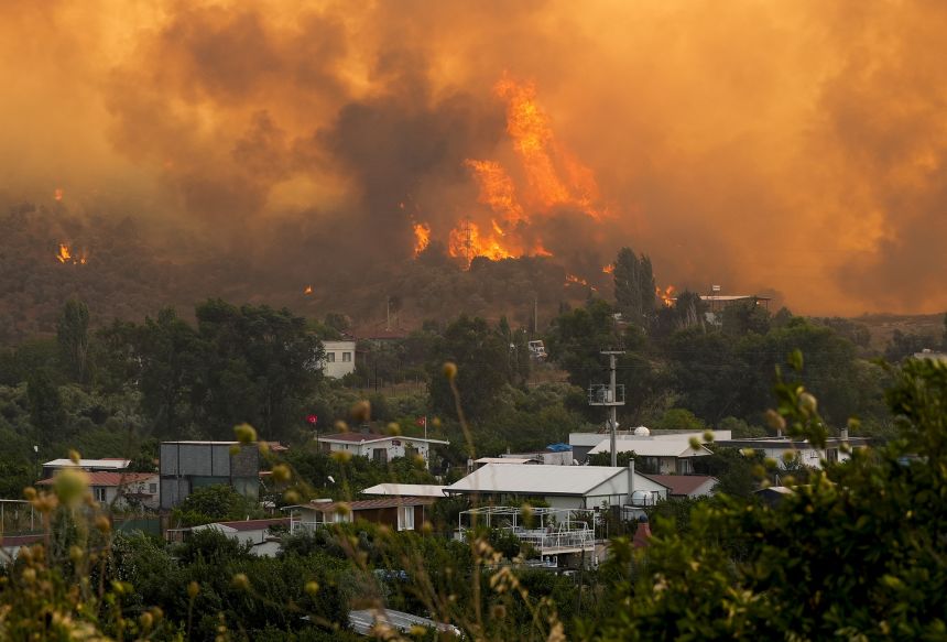 Smoke and flames from wildfires in Seferihisar district of Izmir, Turkiye on June 30, 2025.