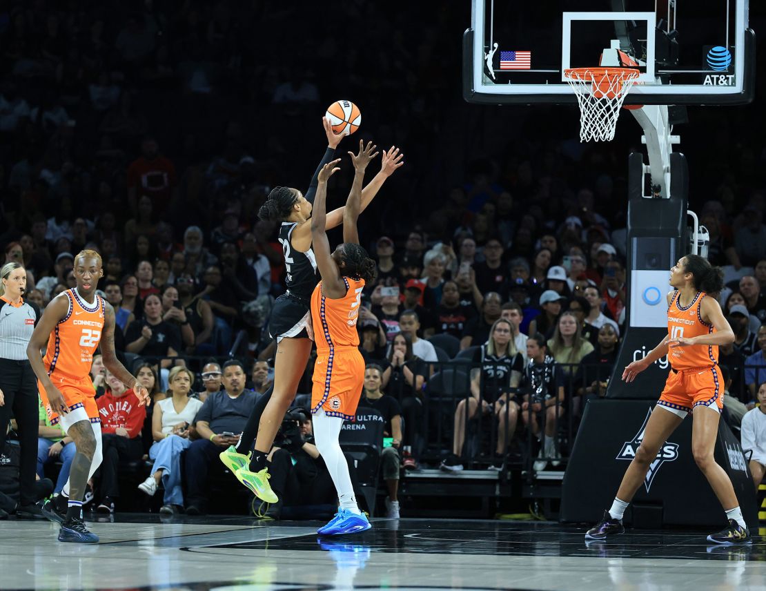 Wilson (left) had 22 points in the Aces' win over the Sun.