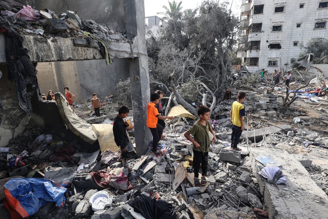 Palestinian children check the rubble of a residential house in Deir el-Balah in the central Gaza Strip on July 1, 2025, following overnight Israeli strikes.