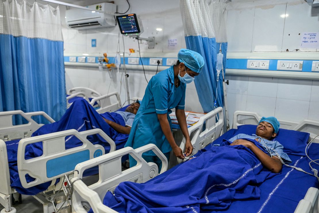 A nurse attends to a victim being treated at a hospital who was injured in the explosion.