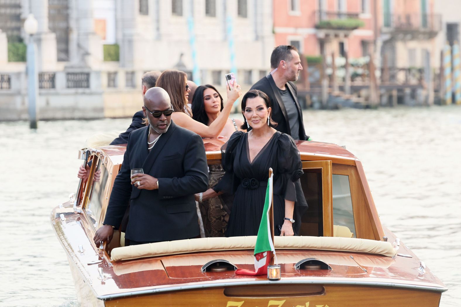 Gamble and Kris Jenner ride a taxi boat as they leave the Gritti Palace hotel on Thursday.