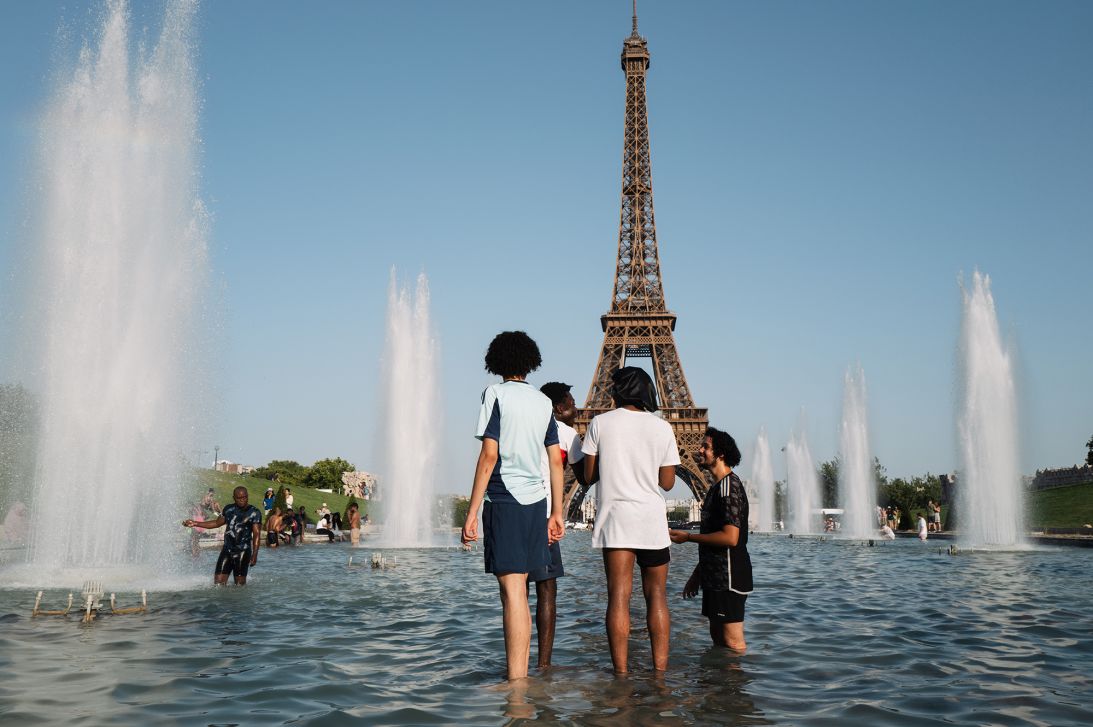 Parisians and tourists cool off at the Trocadero fountain in Paris, France, on July 1, 2025, as the French capital was on red alert for heat.