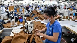 A worker stitches apparels at a garment factory in Vietnam's Thai Nguyen Province on July 2. The country ships shoes, electronics, clothing and more to the United States.