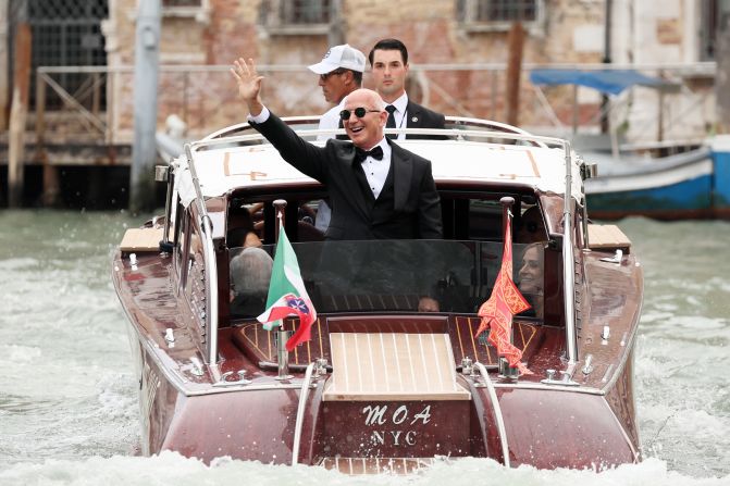 Bezos' boat travels on the Grand Canal as he departs for his wedding on Friday.