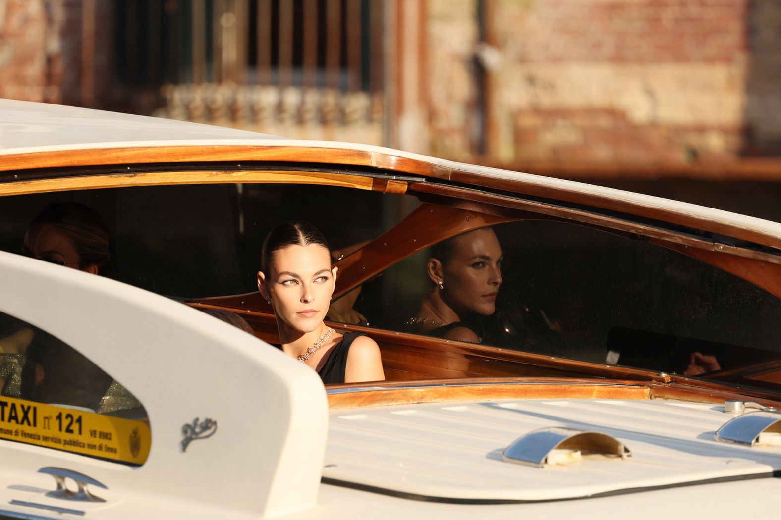 Model Vittoria Ceretti waits on a taxi boat before leaving for the wedding ceremony on Friday.