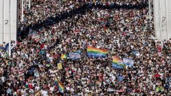 BUDAPEST, HUNGARY - JUNE 28: Participants cross the  Elisabeth Bridge during the Budapest Pride on June 28, 2025 in Budapest, Hungary. Early in 2025, Hungary passed a law restricting the freedom of assembly by connecting it to a previous law from 2021 prohibiting the public portrayal to children of 'divergence from self-identity corresponding to sex at birth, sex change or homosexuality'. Consequently, events such as Pride marches are illegal in the country. The LGBTQ+ community are defying the ban and holding their Pride event on the streets of Budapest. (Photo by Janos Kummer/Getty Images)
