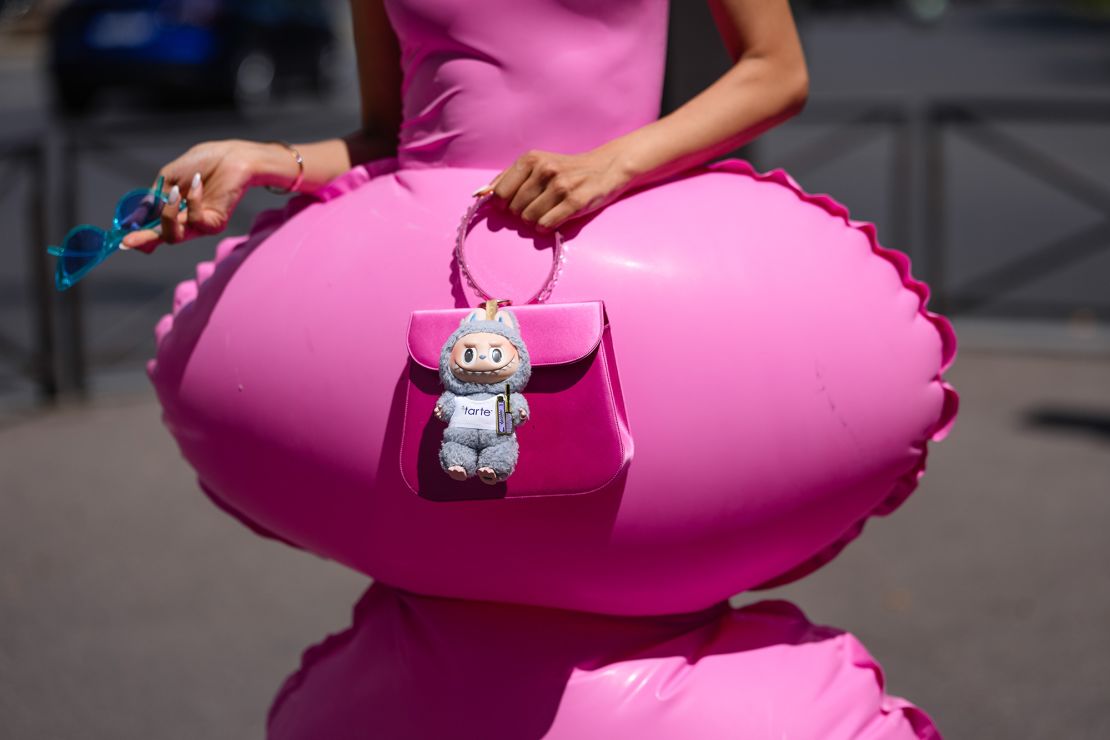 At the Paris Fashion Week men's shows, actor and TV host Patricia Contreras combined pink latex with a grey Labubu.