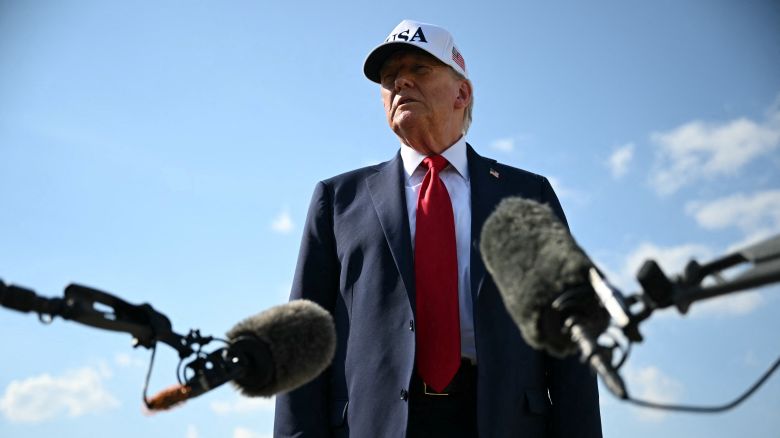 President Donald Trump speaks to reporters at Joint Base Andrews in Maryland as he departs to deliver remarks the Iowa State Fairgrounds in Des Moines on Thursday.
