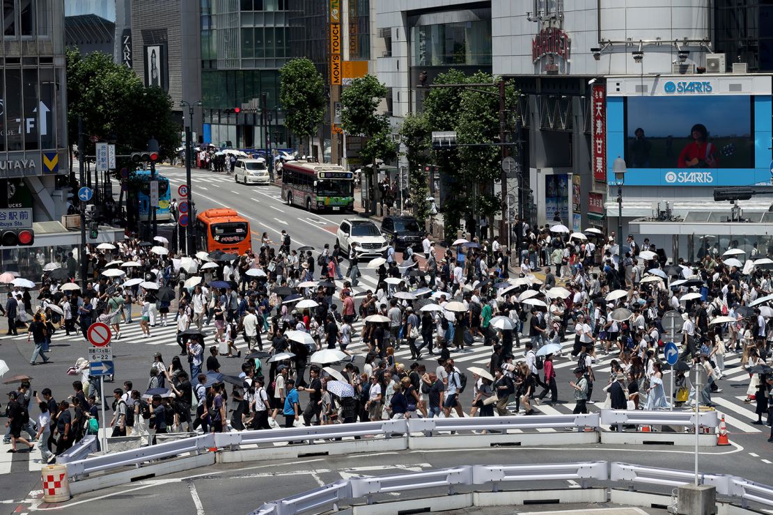 Tourists and pedestrians fill the streets of Shibuya on June 29, 2025 in Tokyo, Japan.