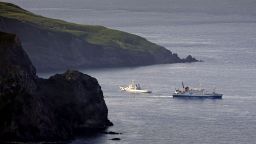 A ferry carrying evacuating residents and visitors sails out of Akuseki Island in southwestern Japan on Saturday.
