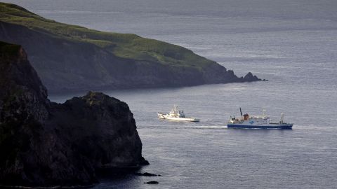 A ferry carrying evacuating residents and visitors sails out of Akuseki Island in southwestern Japan on Saturday.