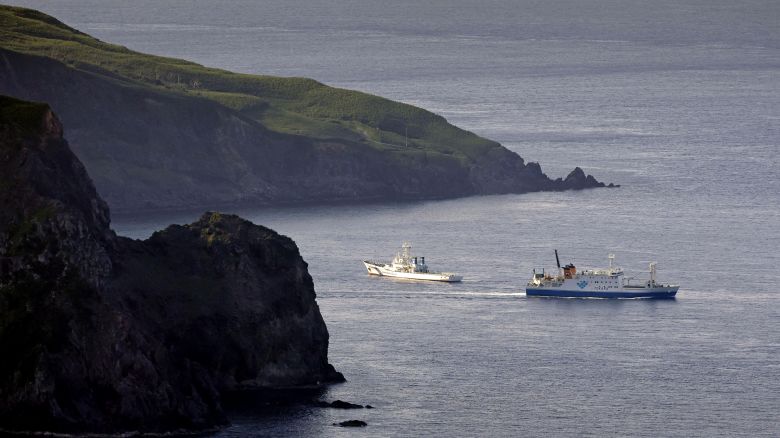 A ferry carrying evacuating residents and visitors sails out of Akuseki Island in southwestern Japan on Saturday.