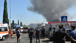 TOPSHOT - Firemen, policemen and rescue teams work on the site of an explosion in a fuel station in Rome on July 4, 2025. At least ten people were injured in an explosion with the blast heard across the Italian capital. Neighbouring buildings were evacuated following the explosion, which occurred shortly after 8am during what media reports said was a refueling operation. (Photo by Andreas SOLARO / AFP) (Photo by ANDREAS SOLARO/AFP via Getty Images)          