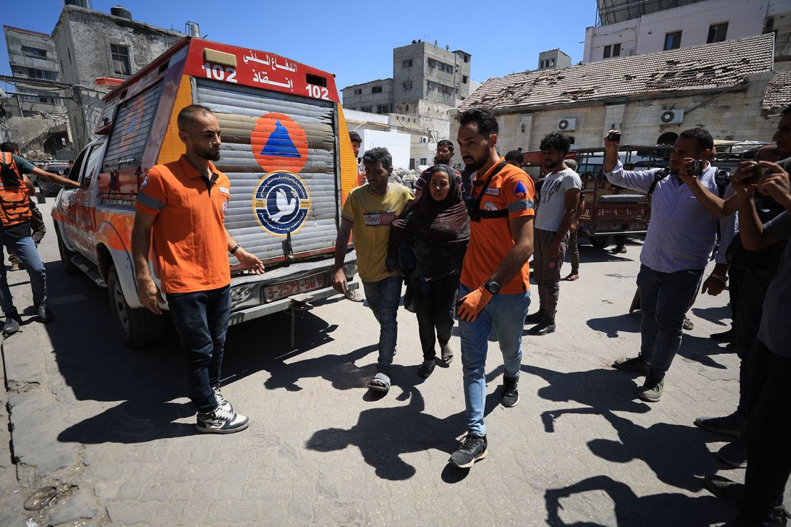 Injured Palestinians are brought to al-Ahli Baptist Hospital to receive medical treatment after an Israeli airstrike in the Gaza Strip on July 4, 2025.