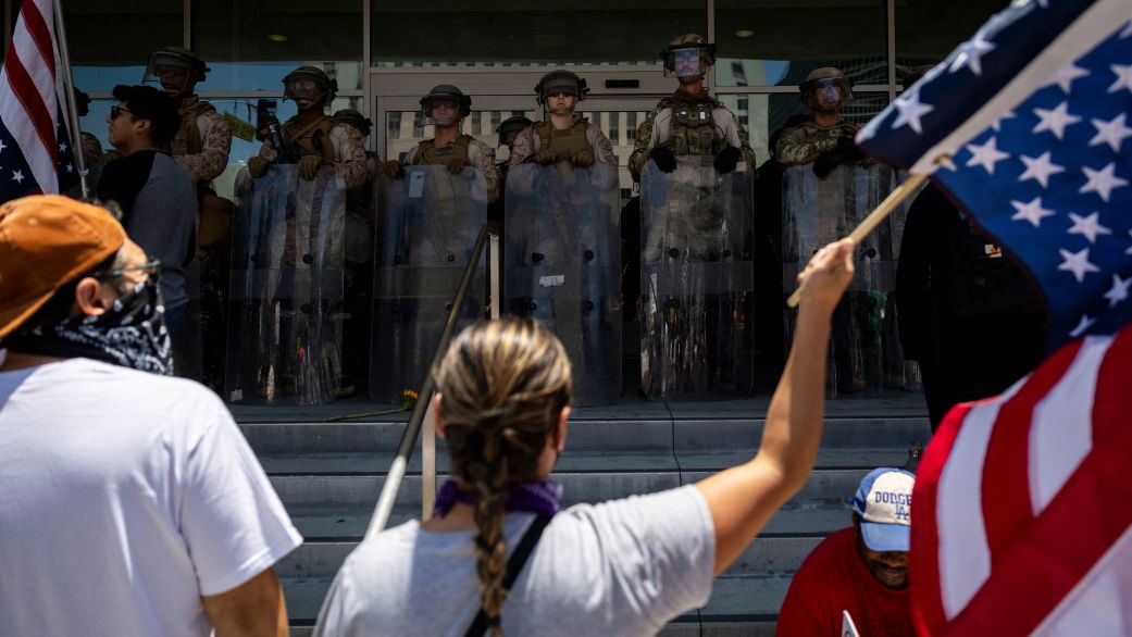Demonstrators gather in front of the Federal building guarded by a mix of US marines and National guards during the "No Kings" protest following federal immigration operations, in Los Angeles, California on July 4, 2025. According to Immigration and Customs Enforcement (ICE) figures obtained by the Deportation Data Project, which collects US immigration enforcement data, 722 migrants were arrested in Los Angeles and the surrounding area from June 1 to 10. (Photo by ETIENNE LAURENT / AFP) (Photo by ETIENNE LAURENT/AFP via Getty Images)          