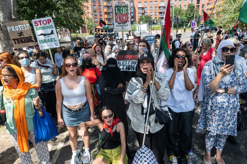 People protest in support of jailed Palestine Action activists, known as "The Filton 18," in London in June.