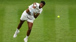 LONDON, ENGLAND - JUNE 30: Giovanni Mpetshi Perricard of France serves against Taylor Fritz of United States during the Gentlemen's Singles first round match on day one of The Championships Wimbledon 2025 at All England Lawn Tennis and Croquet Club on June 30, 2025 in London, England. (Photo by Mike Hewitt/Getty Images)