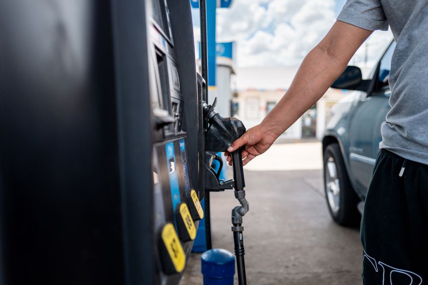 A person pumps gas at a Valero gas station on June 30 in Austin, Texas. President Donald Trump's sanctions on Russia could raise prices at the pump for Americans.