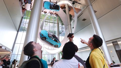 Foreign students visit Xiaomi Auto Super Factory on June 30, 2025 in Beijing, China.