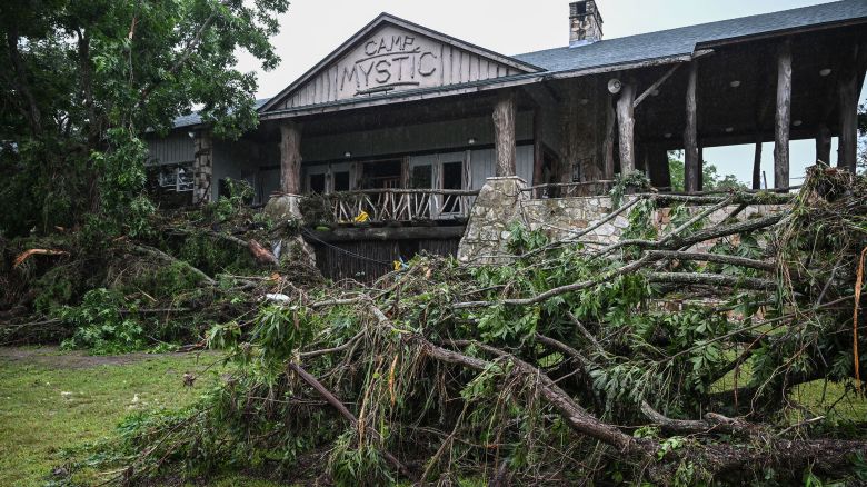 A view of Camp Mystic, the site of where at least 20 girls went missing after flash flooding in Hunt, Texas, on July 5, 2025. Rescuers were on Saturday searching for more than 20 girls missing from a riverside summer camp in the US state of Texas, after torrential rains caused devastating flooding that killed at least 27 people -- with more rain on the way. "So far, we've evacuated over 850 uninjured people, eight injured people and have recovered 27 deceased fatalities at this time. Of these 27, 18 are adults, nine are children," said Kerr Country Sheriff Larry Leitha on July 5. (Photo by RONALDO SCHEMIDT / AFP) (Photo by RONALDO SCHEMIDT/AFP via Getty Images)          