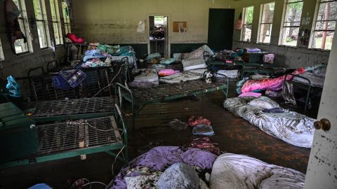 TOPSHOT - A view inside of a cabin at Camp Mystic, the site of where at least 20 girls went missing after flash flooding in Hunt, Texas, on July 5, 2025. Rescuers were on Saturday searching for more than 20 girls missing from a riverside summer camp in the US state of Texas, after torrential rains caused devastating flooding that killed at least 27 people -- with more rain on the way. "So far, we've evacuated over 850 uninjured people, eight injured people and have recovered 27 deceased fatalities at this time. Of these 27, 18 are adults, nine are children," said Kerr Country Sheriff Larry Leitha on July 5. (Photo by RONALDO SCHEMIDT / AFP) (Photo by RONALDO SCHEMIDT/AFP via Getty Images)          