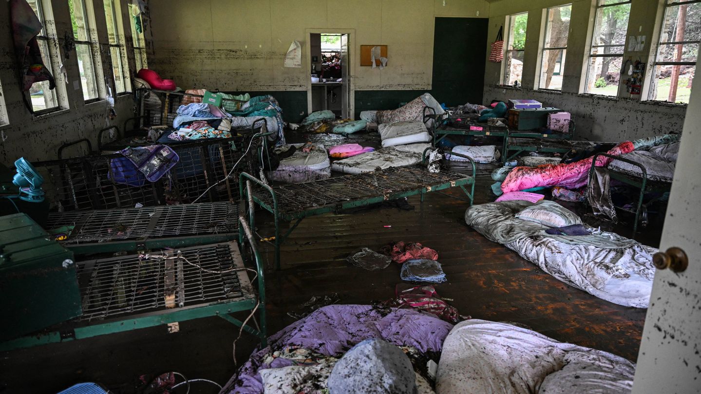 TOPSHOT - A view inside of a cabin at Camp Mystic, the site of where at least 20 girls went missing after flash flooding in Hunt, Texas, on July 5, 2025. Rescuers were on Saturday searching for more than 20 girls missing from a riverside summer camp in the US state of Texas, after torrential rains caused devastating flooding that killed at least 27 people -- with more rain on the way. "So far, we've evacuated over 850 uninjured people, eight injured people and have recovered 27 deceased fatalities at this time. Of these 27, 18 are adults, nine are children," said Kerr Country Sheriff Larry Leitha on July 5. (Photo by RONALDO SCHEMIDT / AFP) (Photo by RONALDO SCHEMIDT/AFP via Getty Images)          