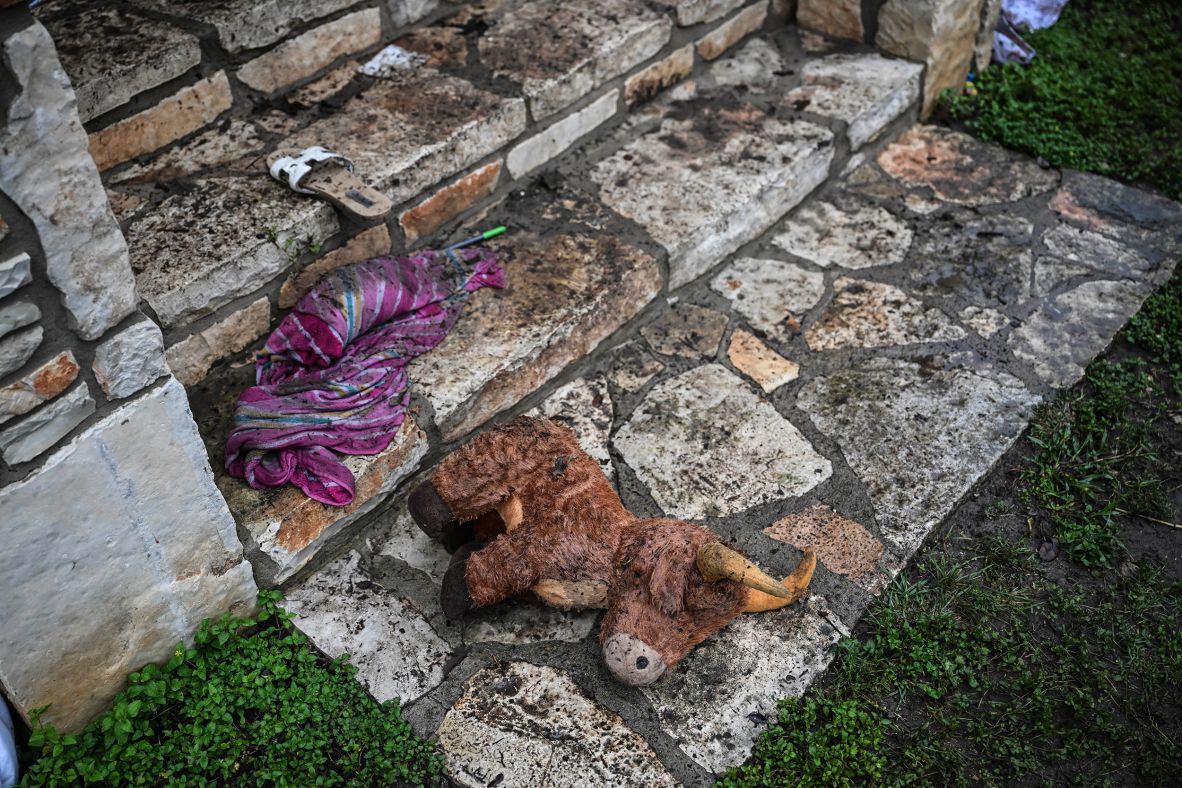 A toy sits on the ground outside of a cabin at Camp Mystic on Saturday.