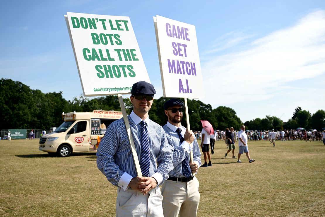 People dressed as line judges make their feelings known about the blanket use of electronic line calling at Wimbledon.