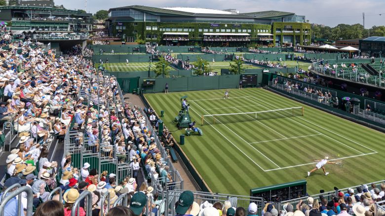 LONDON, ENGLAND - JULY 01: A general panoramic view of Wimbledon packed with spectators, with a back-drop of Centre Court, as Clara Tauson of Denmark plays against Heather Watson of Great Britain in the first round of the Ladies' Singles Competition on No.12 Court during the Wimbledon Lawn Tennis Championships at the All England Lawn Tennis and Croquet Club at Wimbledon on July 1st, 2025, in London, England. (Photo by Tim Clayton/Getty Images)