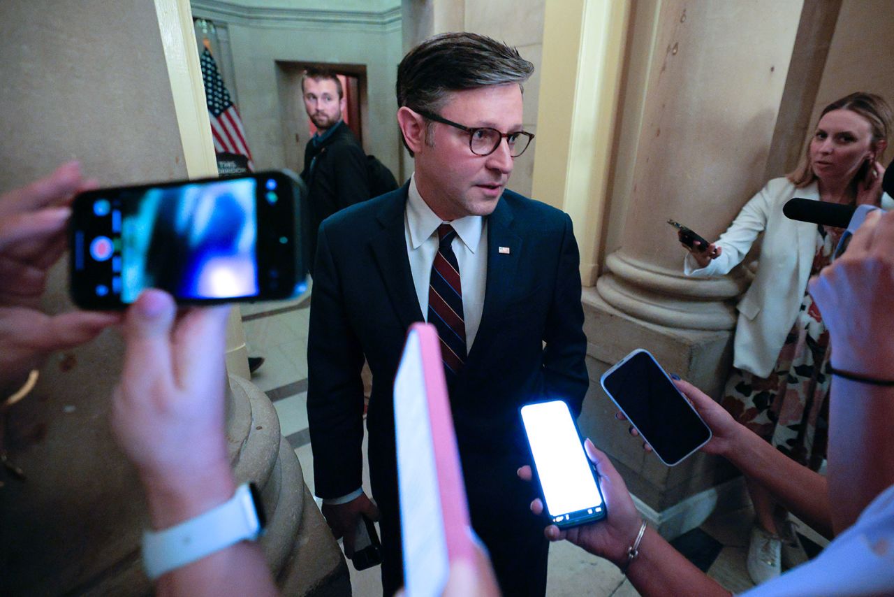 Speaker of the House Mike Johnson speaks with reporters as he returns to his office after going to the House Rules Committee at the US Capitol on Tuesday.
